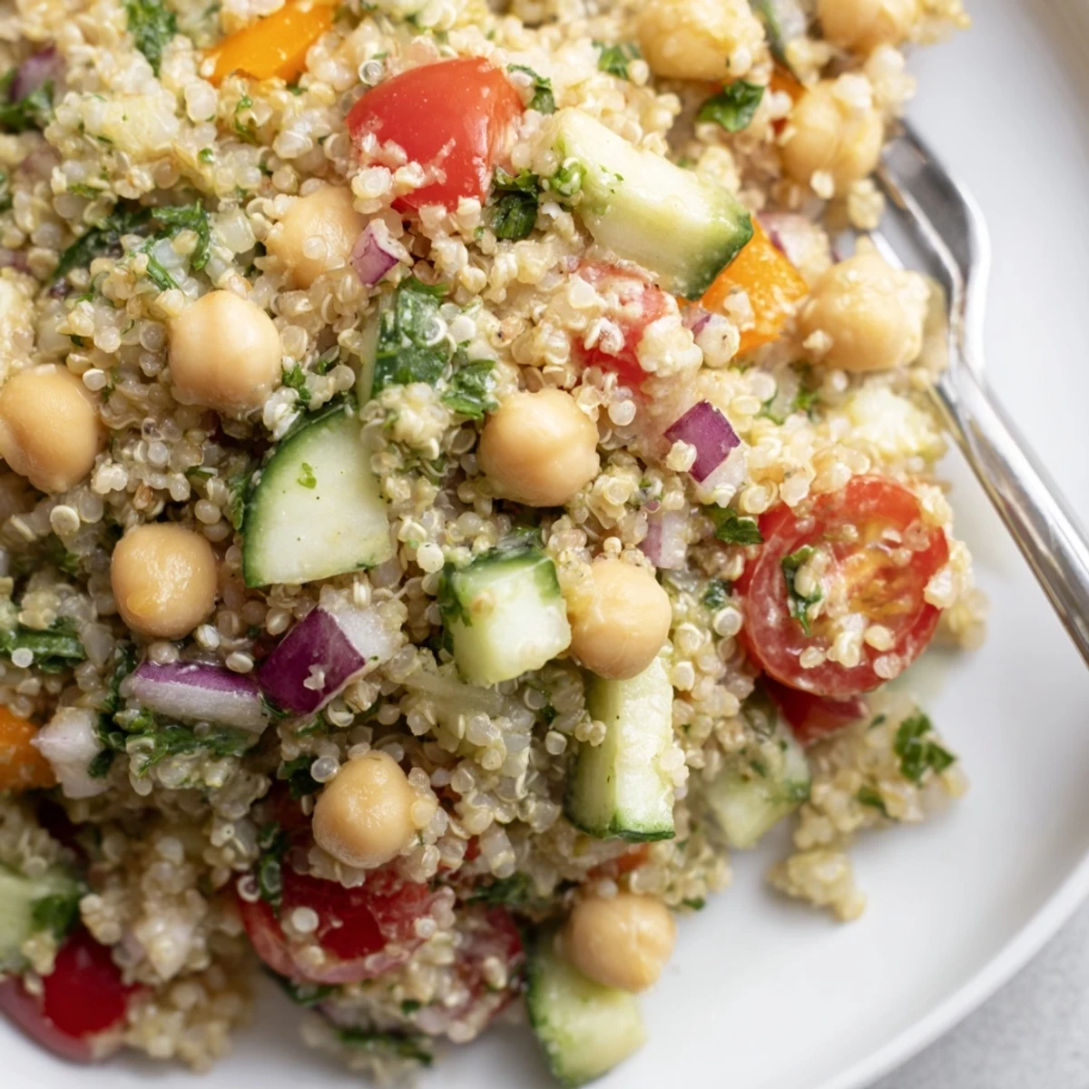 Fresh ingredients combine in this quinoa salad with chickpeas and zesty avocado dressing.  