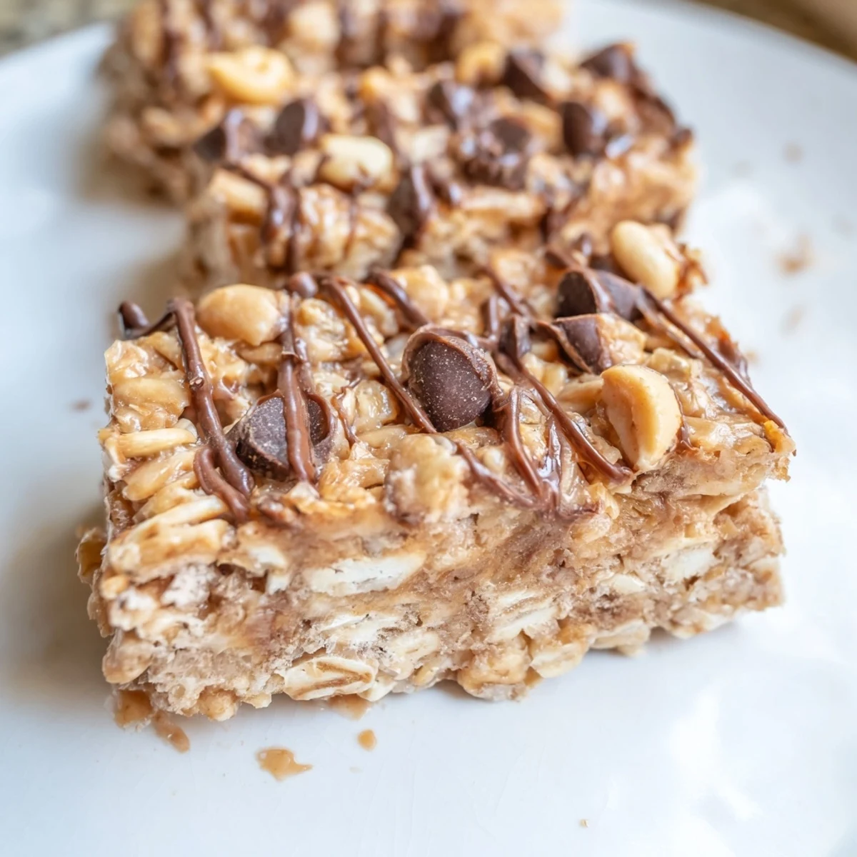 Nutty No-Bake Peanut Butter Oat Bars stacked high for a quick grab-and-go treat.