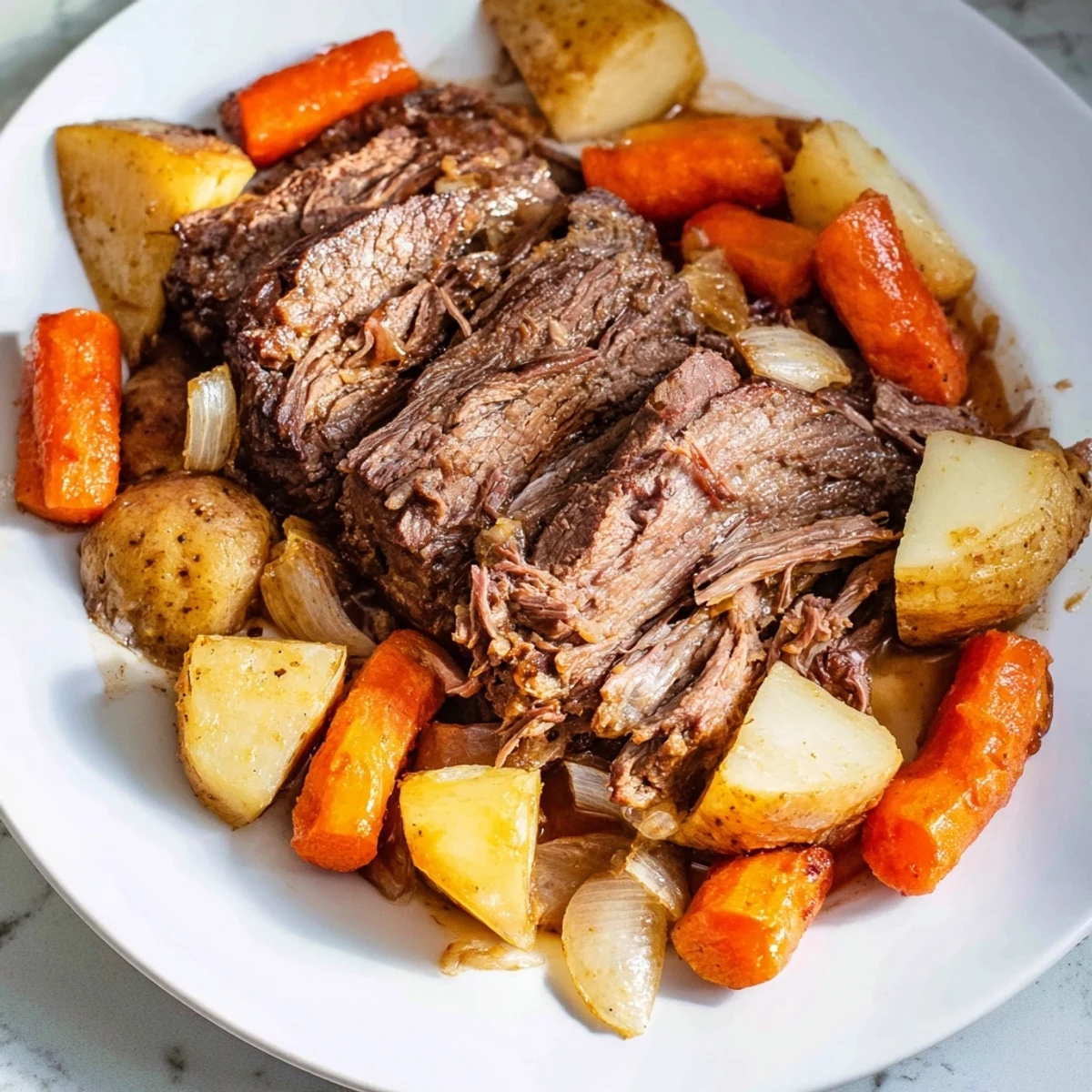 Fork-tender Sunday Pot Roast, braised in red wine, served with vibrant, roasted root vegetables.