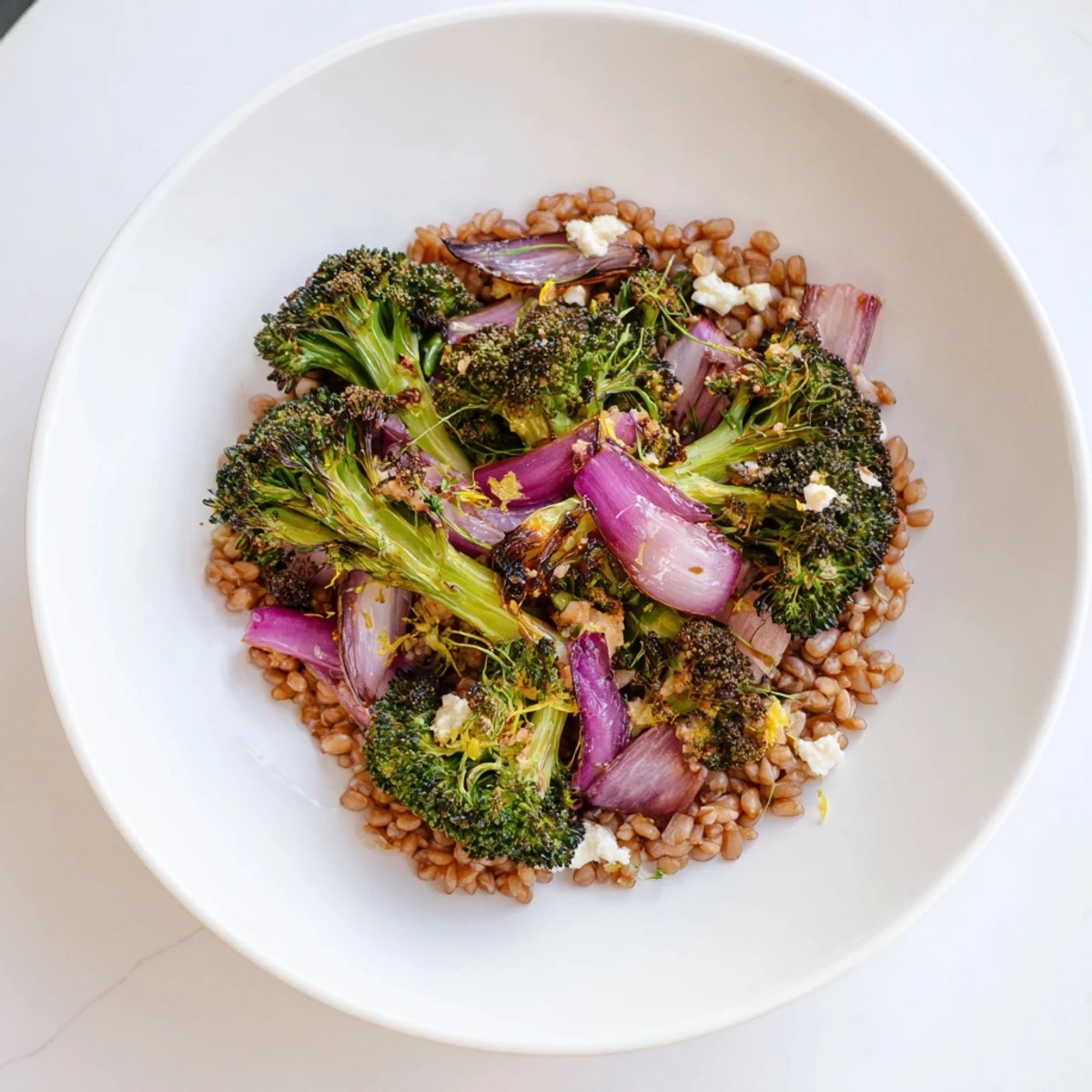 Golden roasted broccoli and red onion mingle with nutty farro in this healthy recipe.