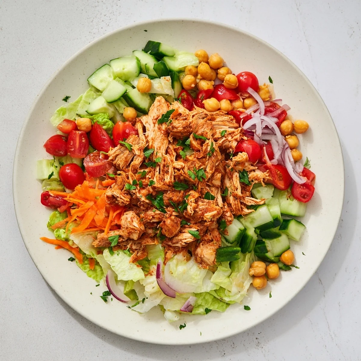 Freshly prepared, vibrant chicken salad featuring juicy chicken and colorful, crisp salad ingredients.