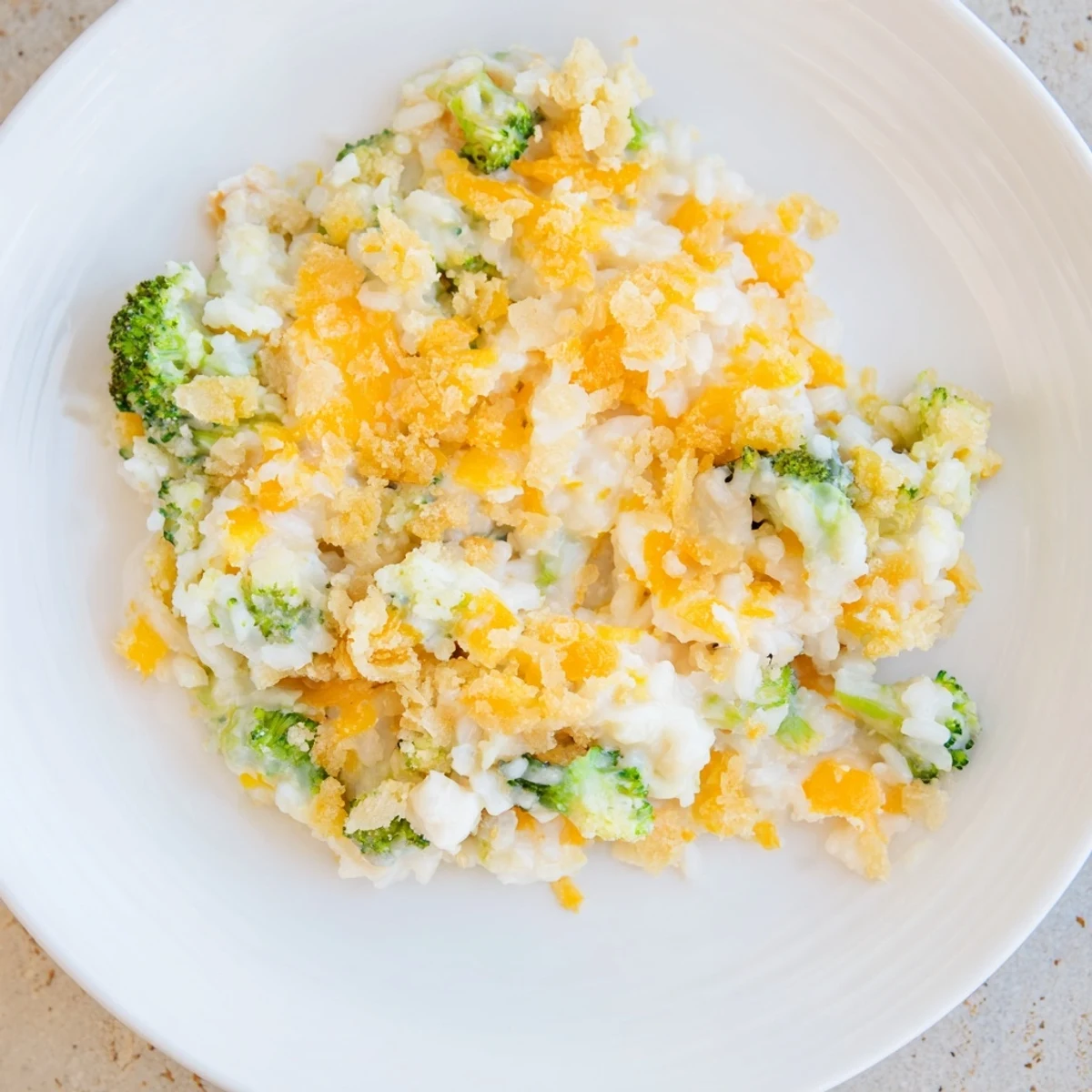 Golden, bubbly Chicken & Broccoli Rice Casserole, a family favorite with creamy sauce and cheese.