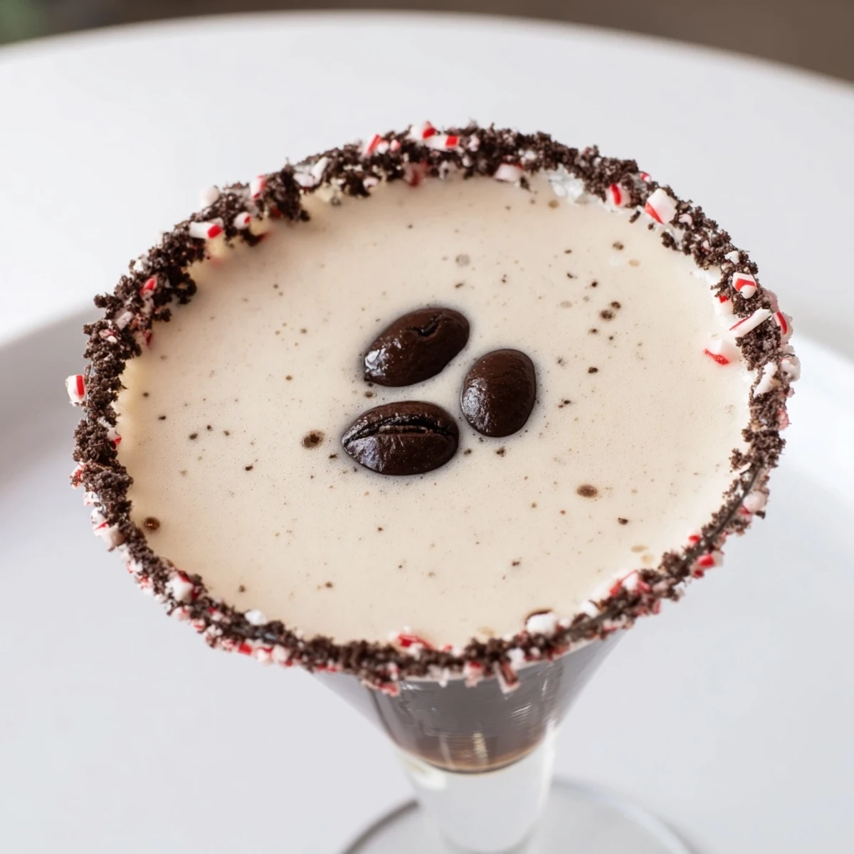 A close-up of icy Peppermint Espresso Martinis, garnished with coffee beans, perfect for a special occasion.