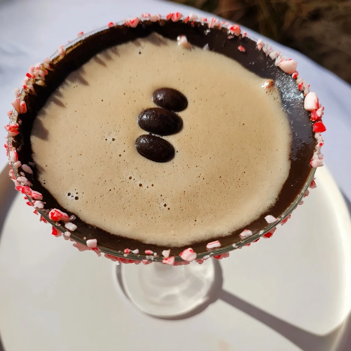Creamy Peppermint Espresso Martinis in elegant glasses, showing the vibrant mix of coffee and festive flavors.