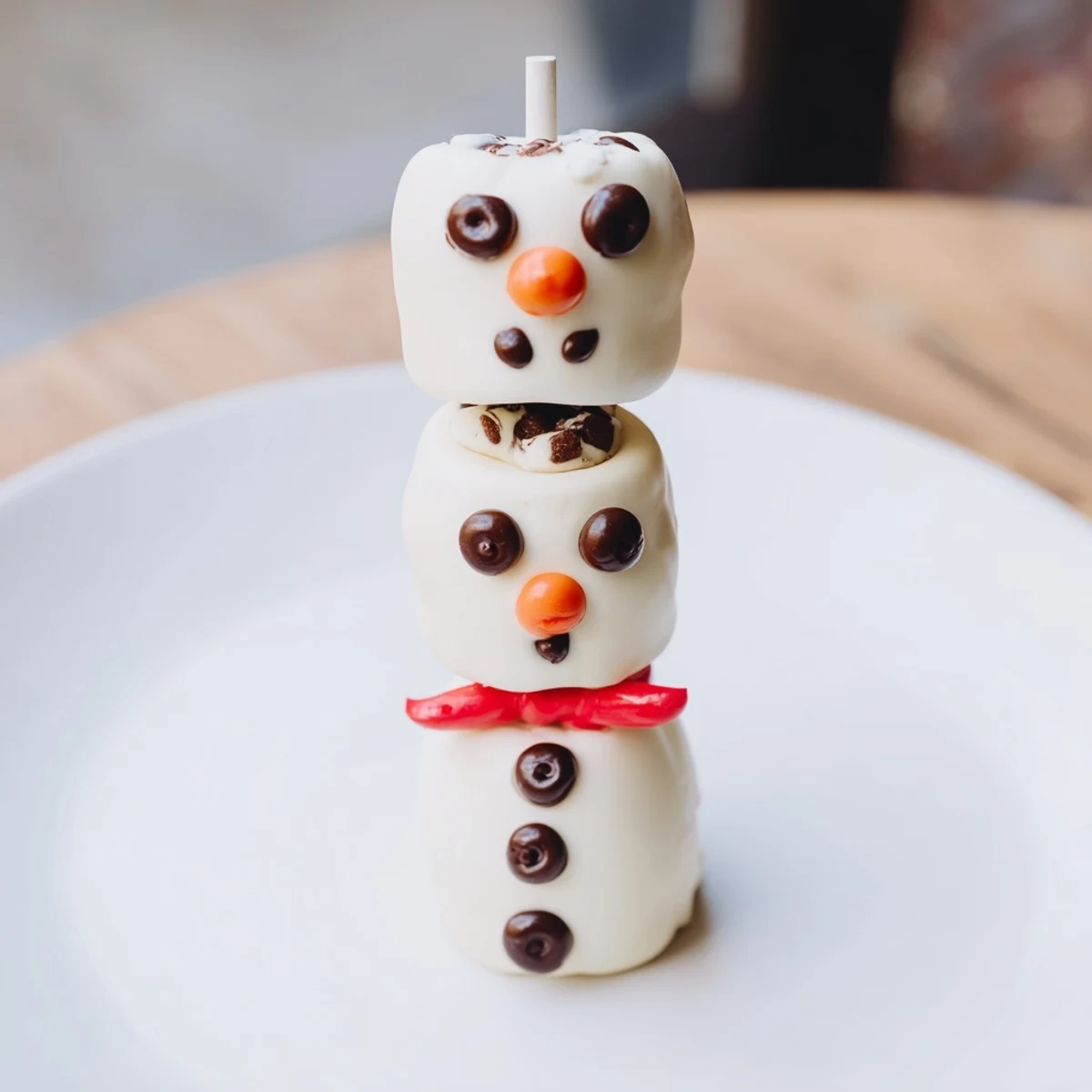 Festive Express Snowman Marshmallow Pops, perfect for a cheerful holiday dessert, ready to enjoy.