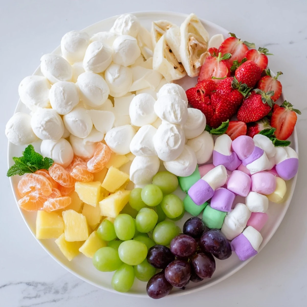 Vibrant Cloud & Rainbow Grazing Board with colorful fruits, cheeses, and sweet treats ready to enjoy.