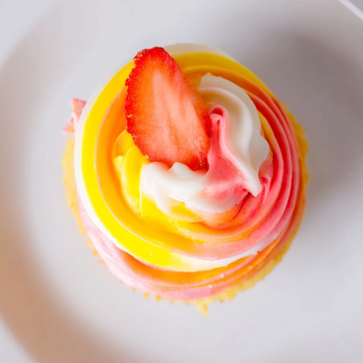 These homemade Mango Strawberry Sunset Cupcakes feature a delicious tropical flavor combination, perfect now.