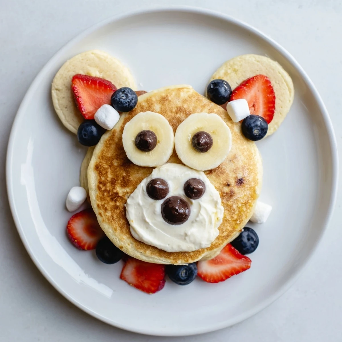 A whimsical brunch: a Polar Bear Pancake Stack Board with fluffy pancakes, fruit, and toppings.