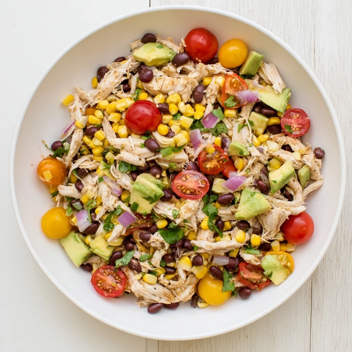 A colorful bowl of Dense Southwestern Bean Salad, perfect for a picnic or quick lunch fix.