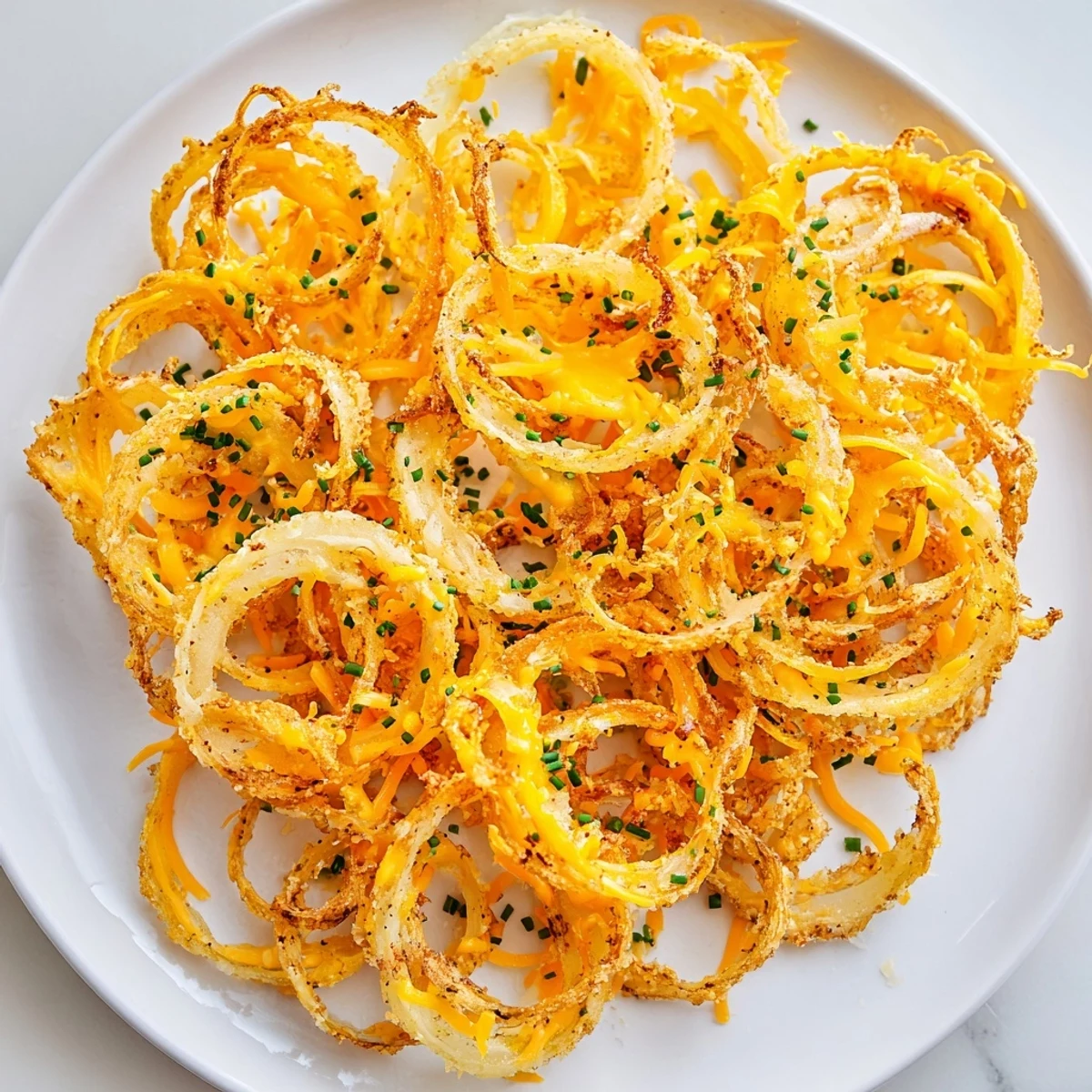 Air-fried and bubbly, these appetizing Crispy Onion Cheese Chips are perfectly seasoned and ready to enjoy.