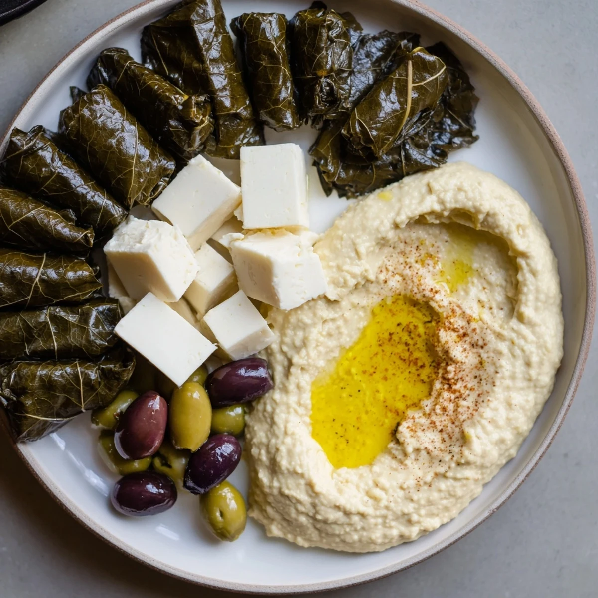 A Turkish Meze Platter overflowing with colorful dips, cheeses, olives, and fresh vegetables, inviting a taste.