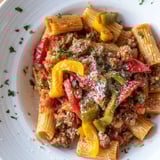 Close-up of hearty Sausage and Peppers Pasta with a rich tomato sauce, ready to be enjoyed.