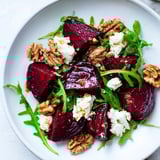 Freshly made Roasted Beet Walnut Salad, featuring roasted beets, goat cheese, and a flavorful dressing.