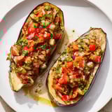 A close-up of steaming Imam Bayildi, a delicious Turkish vegetarian recipe perfect for dinner.