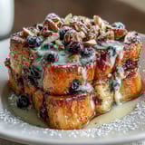 Blueberry Lemon Sourdough French Toast Casserole with fresh blueberries and zesty lemon custard baked until golden and puffy.  