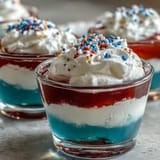 Festive 4th of July Firecracker Jello Shots, red, white, blue, perfect for parties.