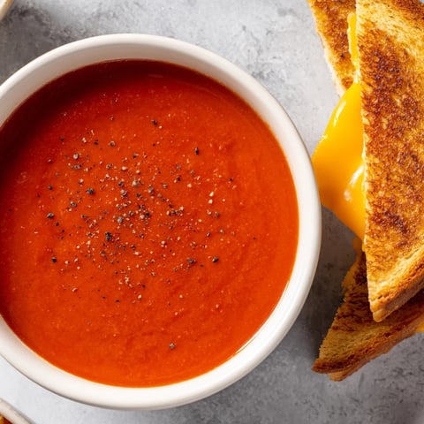Warm, creamy 5-Ingredient Tomato Soup served with golden, dipping grilled cheese for a tasty lunch.