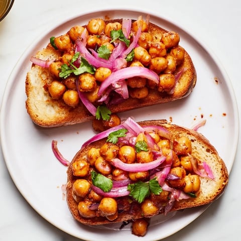 Smoky BBQ chickpeas on golden toast, a quick and satisfying vegan lunch, ready to enjoy.