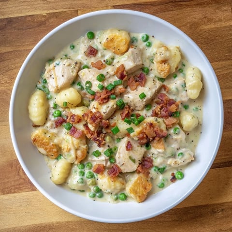 Creamy Crack Chicken Gnocchi, a comforting meal with melted cheese and crispy bacon, ready to eat.