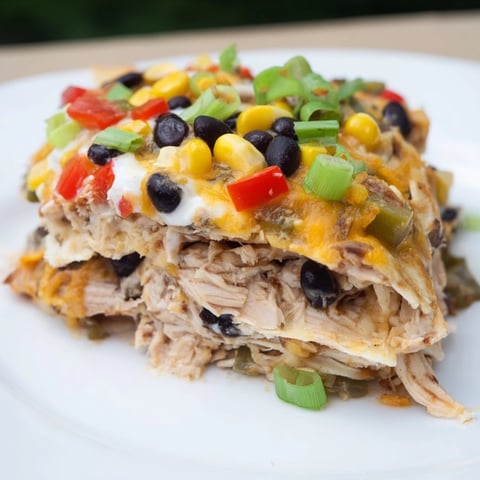 Golden Taco Bell Copycat Chicken Bake with melted cheese and a bubbly, flavorful filling after baking.