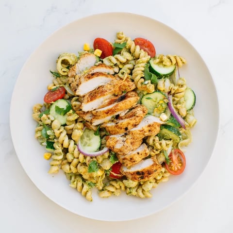 Peruvian Aji Verde Chicken Pasta Salad with colorful vegetables and creamy, bright sauce makes dinner easy.