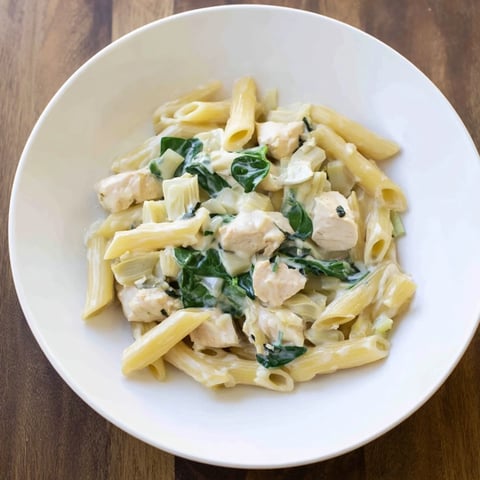 Creamy Spinach Artichoke Protein Pasta Skillet: A delicious one-pan meal with creamy sauce and pasta.