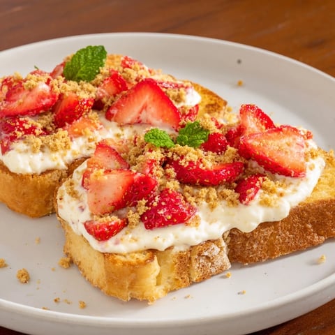 Strawberry Cheesecake Toast, the perfect sweet breakfast featuring glistening, ripe strawberries atop creamy swirls.
