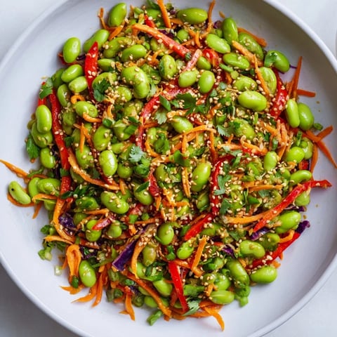 Vibrant Asian Edamame Salad with sesame seeds, a colorful and refreshing dish ready to serve.