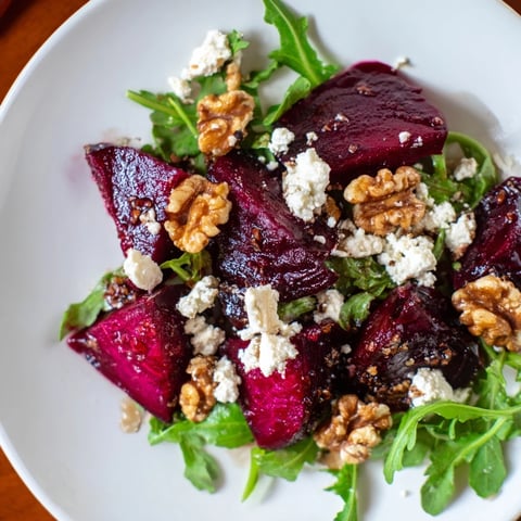 Vibrant Roasted Beet Walnut Salad, a beautiful plate with red beets and candied walnuts.