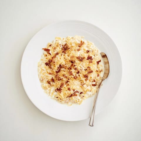 Close-up of creamy Caramelized Onion and Bacon Dip, a savory party food favorite.