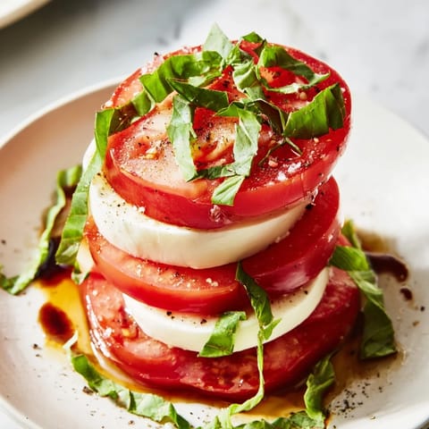 Fresh Tuscan Pillar recipe: a stack of colorful tomato, cheese, and basil, ready to serve and enjoy.