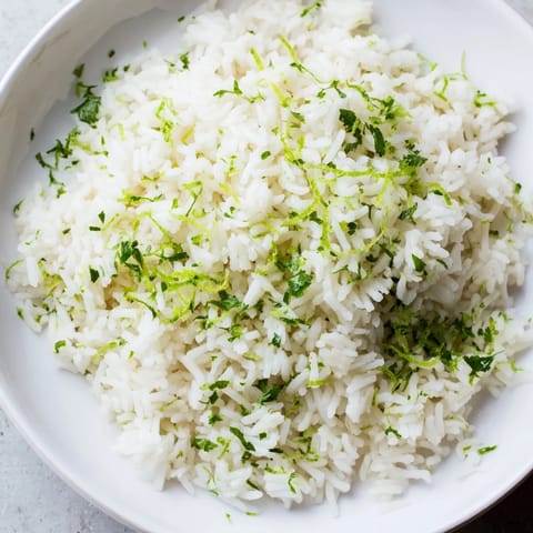 Fresh Cilantro Lime Rice, steaming and fragrant, offering a taste of zesty lime with every bite.