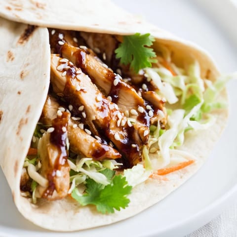 Drizzled with sticky teriyaki glaze and sesame seeds, this wrap is a perfect lunch.