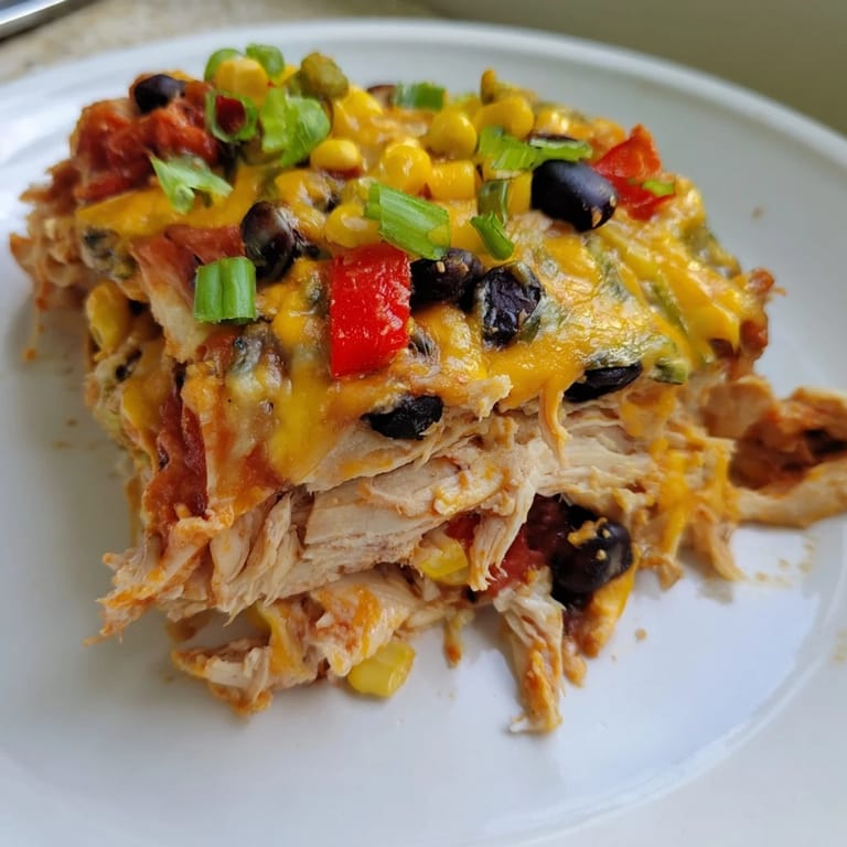 A close-up of a warm Taco Bell Copycat Chicken Bake, showing the tender chicken and savory spices.