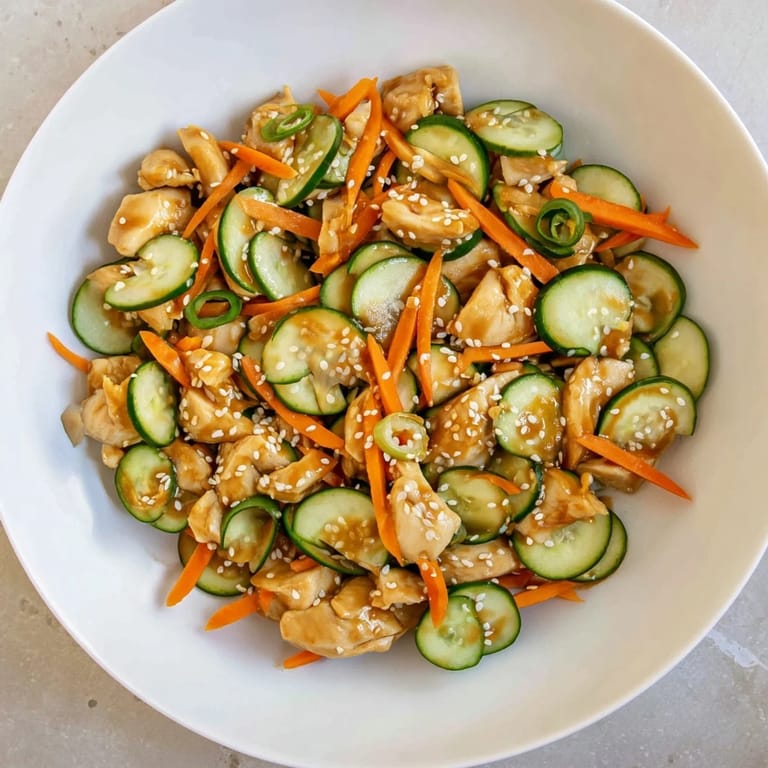 Vibrant photo of Deli Container Shaker Chicken Salad, showcasing flavorful ingredients like cucumber and scallions.