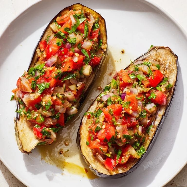 A close-up of steaming Imam Bayildi, a delicious Turkish vegetarian recipe perfect for dinner.