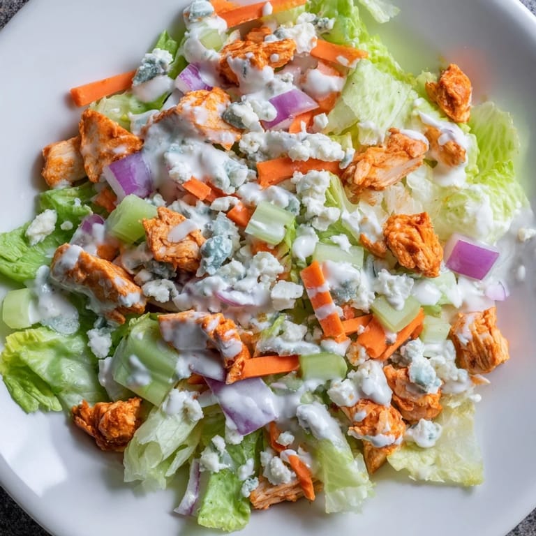 Freshly chopped vegetables and buffalo chicken tossed with ranch dressing for a zesty, satisfying lunch or light dinner.  